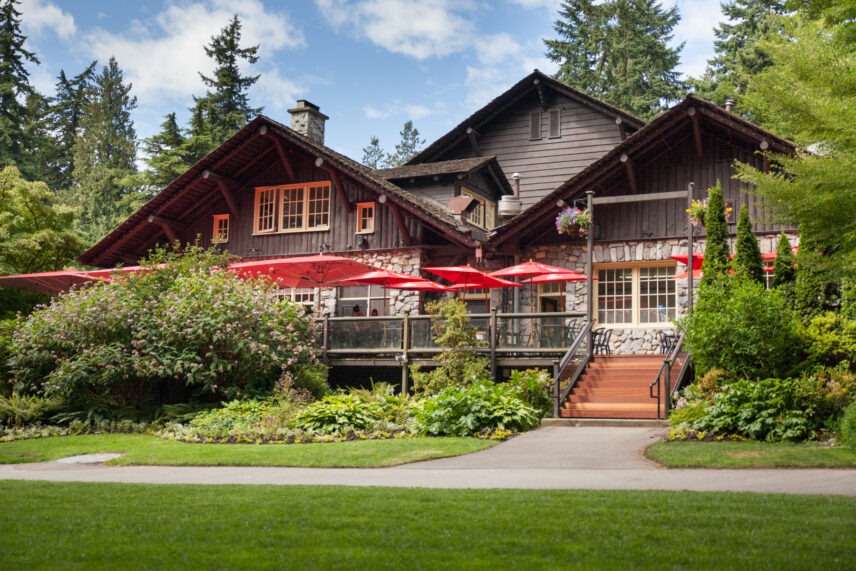 An outsiders view of Stanley's Bar and Grill. The side of the Stanley Park Pavilion in the sunlight