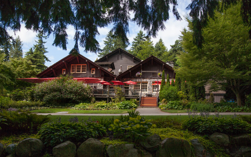 An outsiders view of Stanley's Bar and Grill. The side of the Stanley Park Pavilion in the sunlight