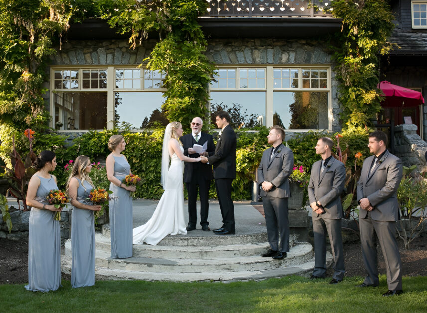 A couple sharing vows outside of the Stanley Park Pavilion