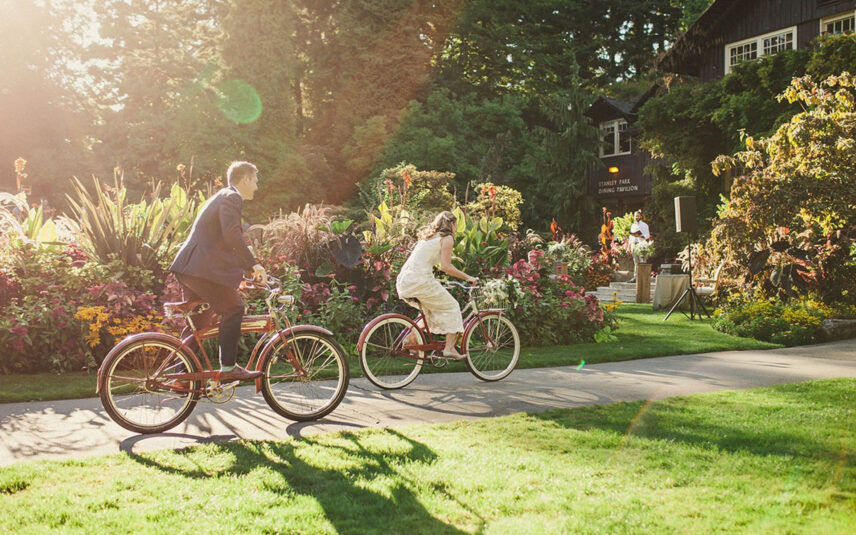 A newly married couple on bikes ride around the Pavilion's grounds.